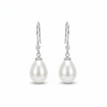 Woman wearing 925 sterling silver freshwater pearl drop earrings with sparkling zirconia accents, elegant bridal jewellery for weddings and special occasions